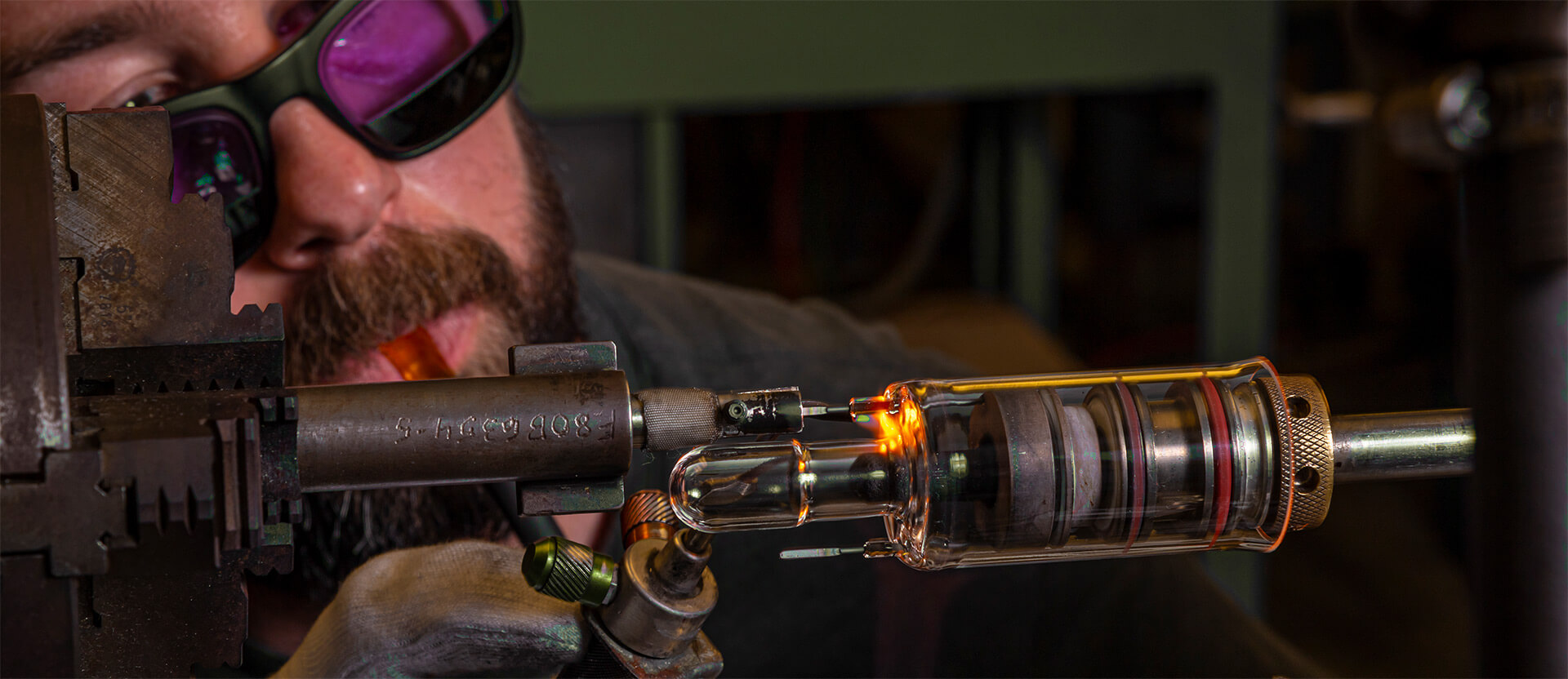 An Astraglass Innovations worker creates a new piece of scientific glassware on industrial machinery